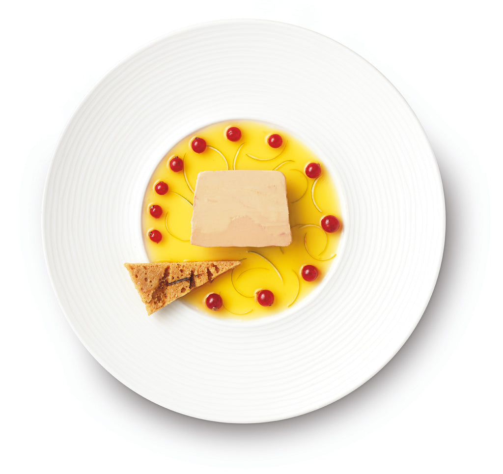 Producto gourmet de Foie Gras de pato de la empresa Rougié para cena de Navidad servido con plato blanco